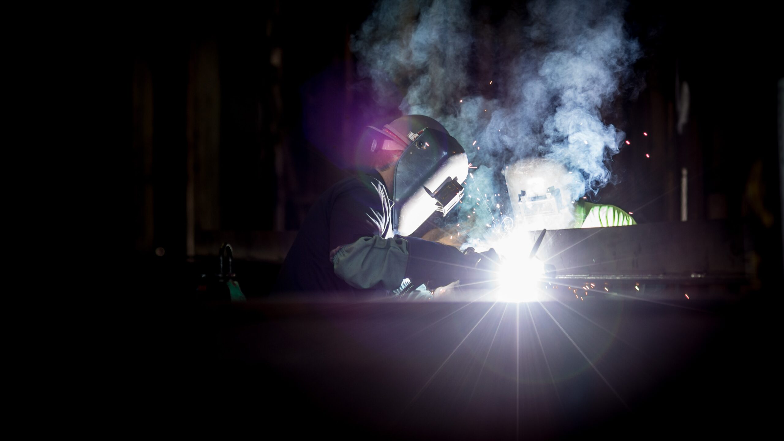 Man in shop welding